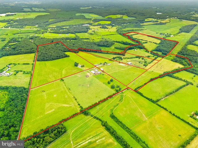 a aerial view of a house with a yard