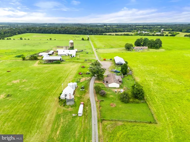 a kitchen with a refrigerator and a stove top oven