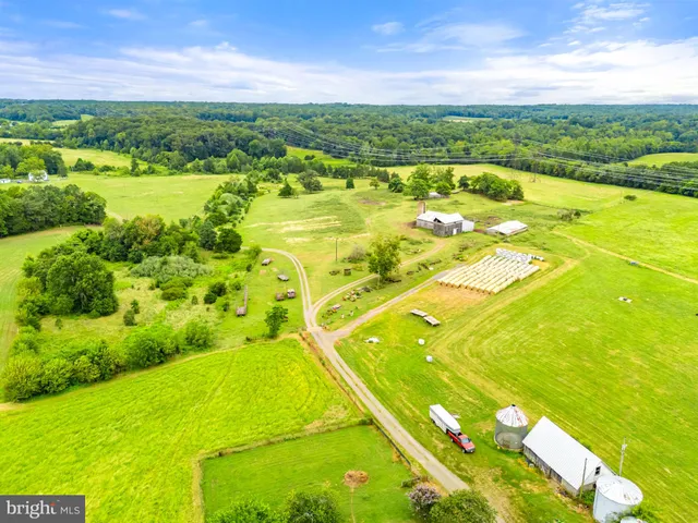 a backyard of a house with lots of green space and garden
