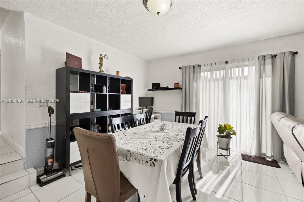 9025 Southwest 36th Street Miami, FL 33165 - Photo 7 of 20 a view of a dining room with furniture