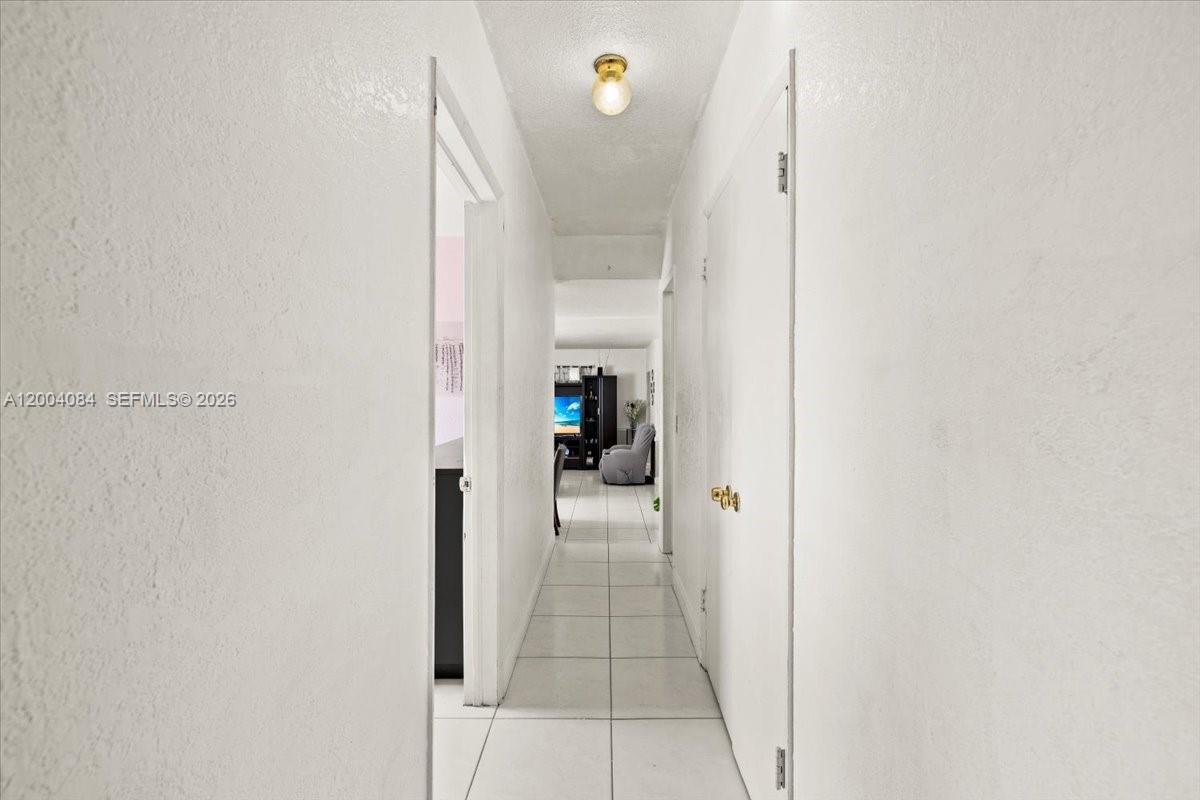 9025 Southwest 36th Street Miami, FL 33165 - Photo 9 of 20 a view of a hallway view with staircase