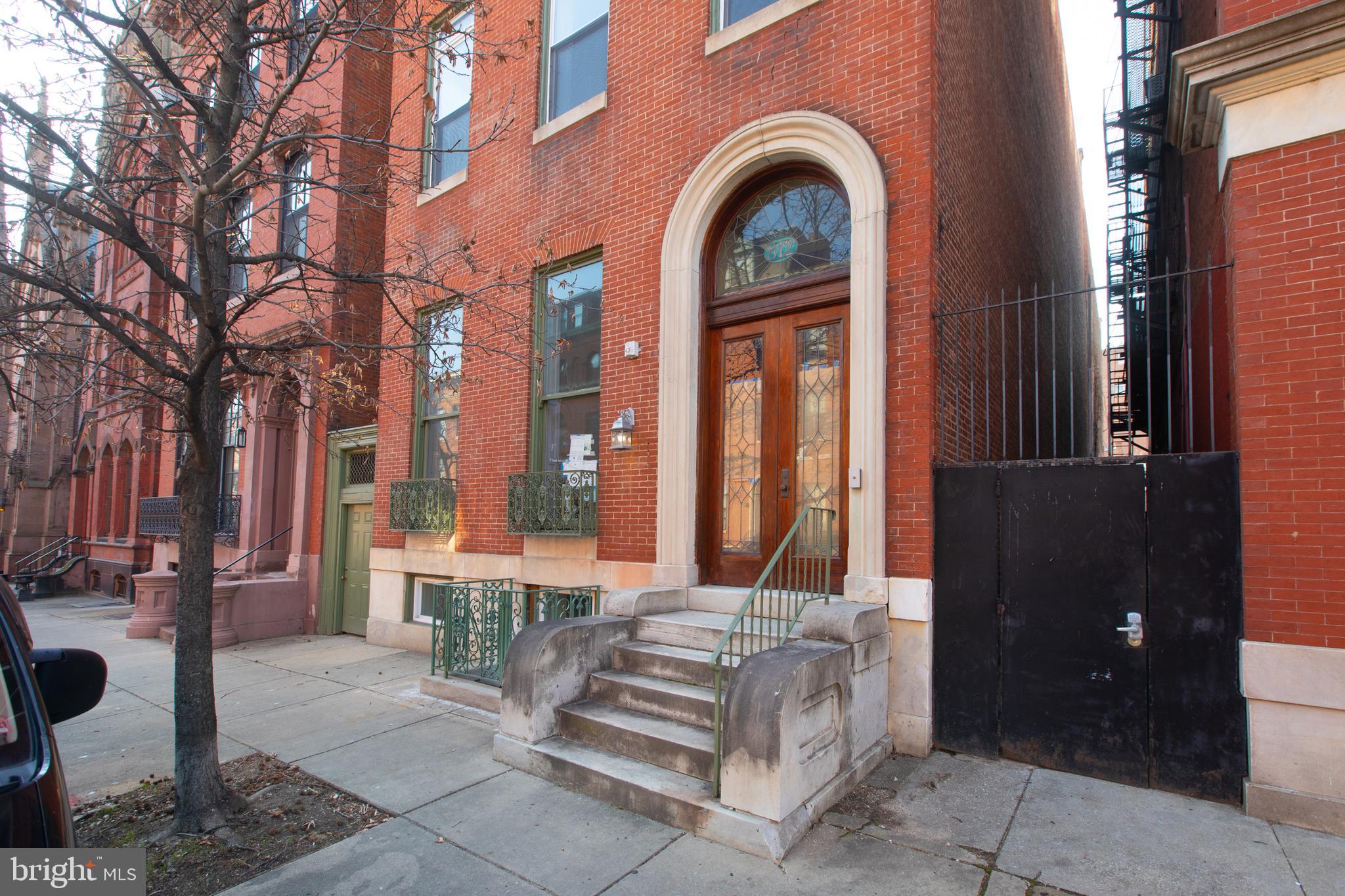 812 Park Avenue, Unit 2FR Baltimore, MD 21201 - Photo 2 of 30 a front view of a house with a garden