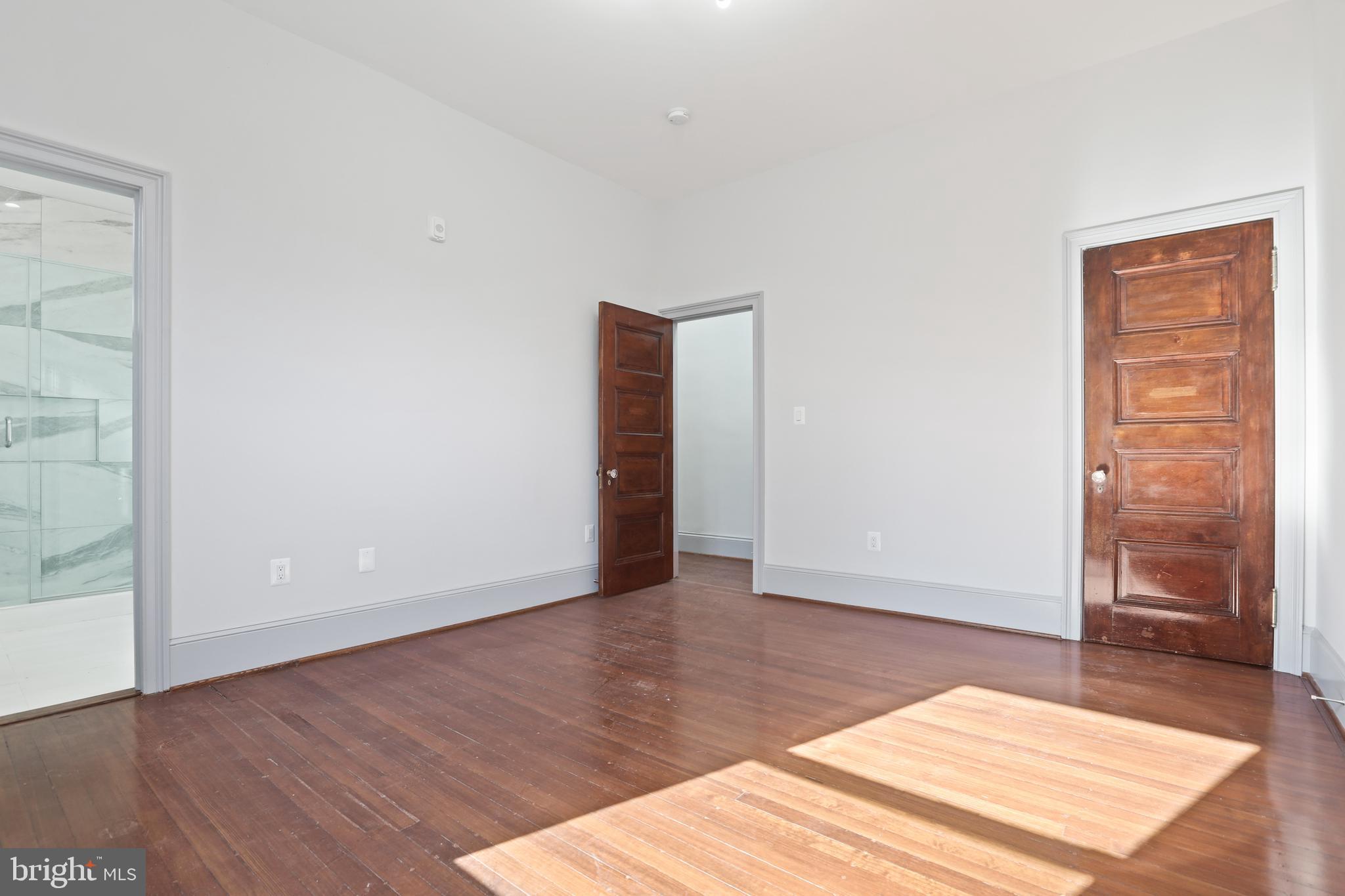 812 Park Avenue, Unit 2FR Baltimore, MD 21201 - Photo 23 of 30 an empty room with wooden floor and closet
