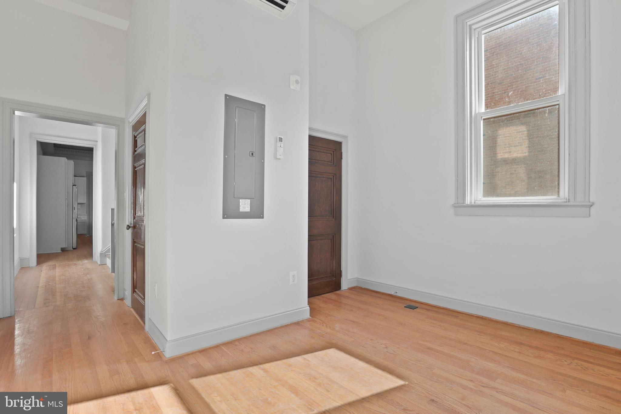 812 Park Avenue, Unit 2FR Baltimore, MD 21201 - Photo 29 of 30 an empty room with windows and closet