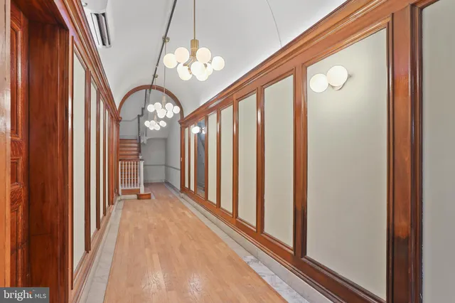 a view of a room with a large mirror and a large window