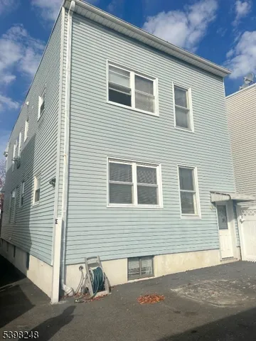 a view of a house with a street