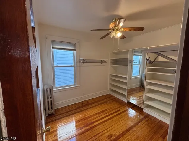 a kitchen with granite countertop a stove a sink and a refrigerator