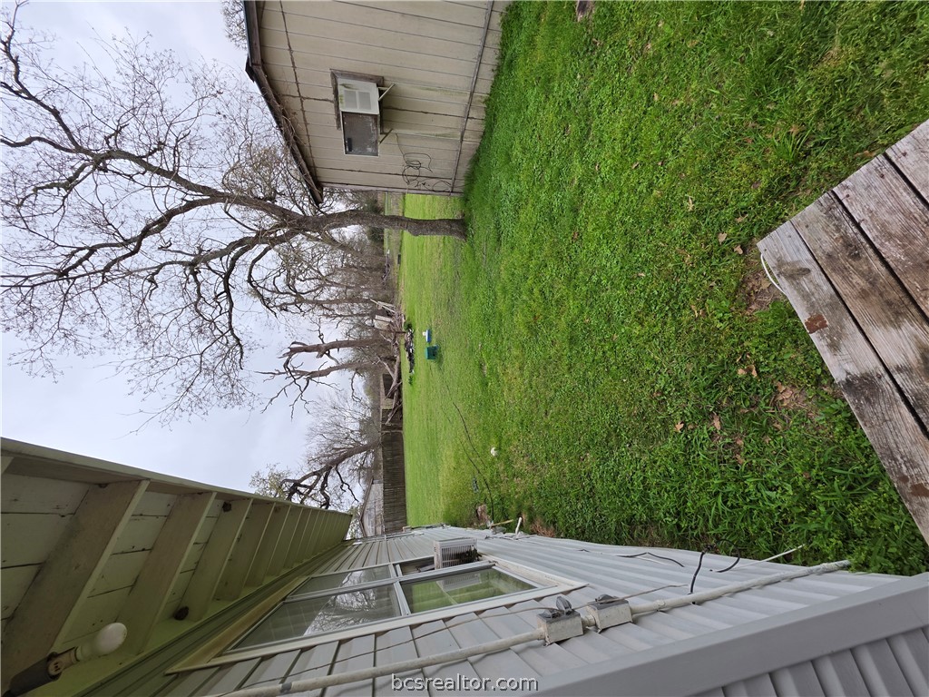 3815 Luza Lane Bryan, TX 77807 - Photo 10 of 18 a backyard of a house with lots of green space