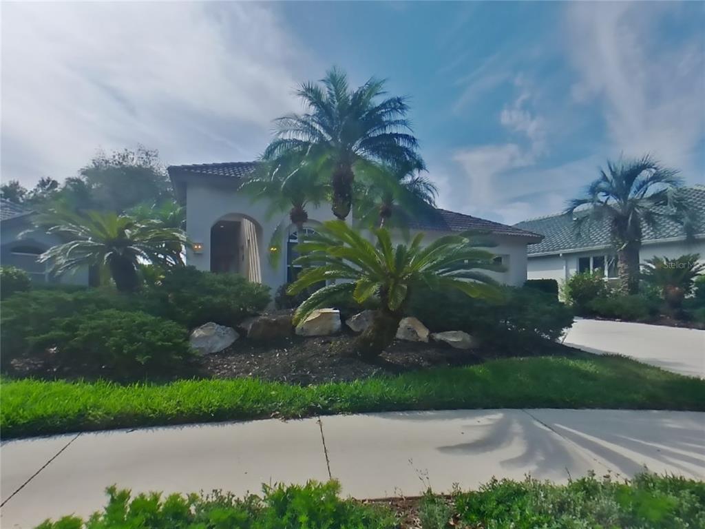 10259 Silverado Circle Bradenton, FL 34202 - Photo 1 of 1 a front view of a house with garden