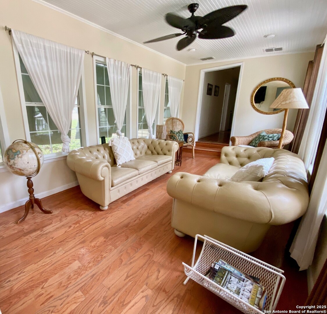 512 County Road 348 Concan, TX 78838 - Photo 18 of 39 a living room with furniture and a large window