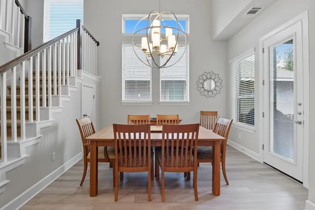 a view of a dining room with furniture and window