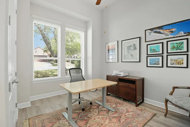 a workspace with furniture and a window