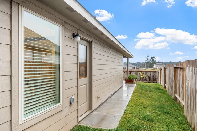 a view of a backyard with pathway