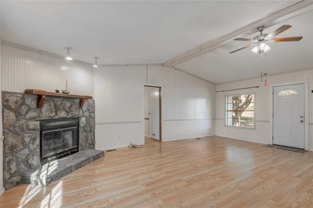 a large kitchen with kitchen island a large counter space a sink appliances and cabinets