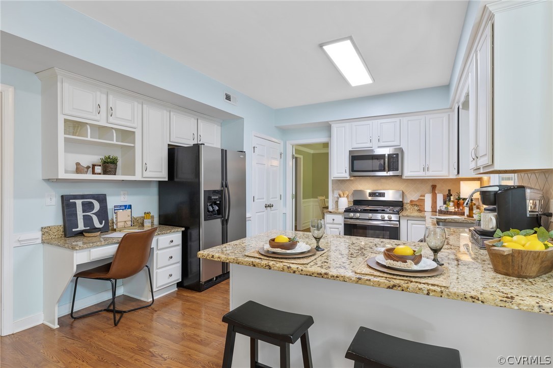 5423 Houndmaster Road Midlothian, VA 23112 - Photo 12 of 49 a kitchen with sink refrigerator stove dining table and chairs