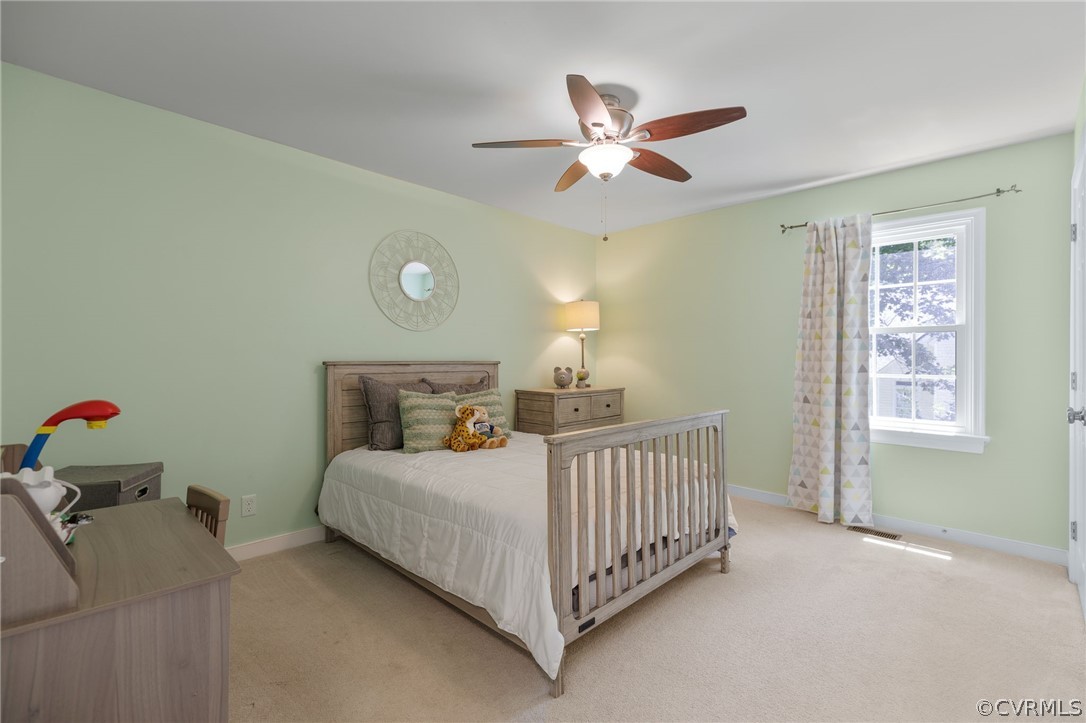 5423 Houndmaster Road Midlothian, VA 23112 - Photo 18 of 49 a bedroom with a bed and window