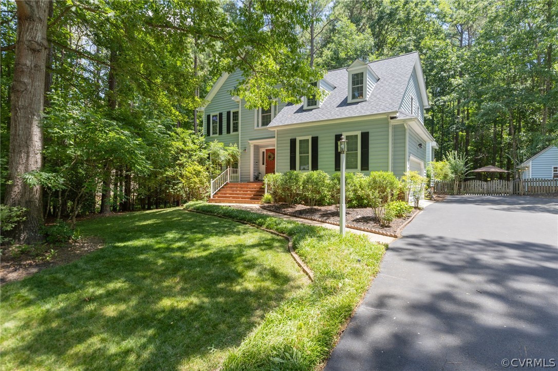 5423 Houndmaster Road Midlothian, VA 23112 - Photo 2 of 49 a front view of house with yard and green space