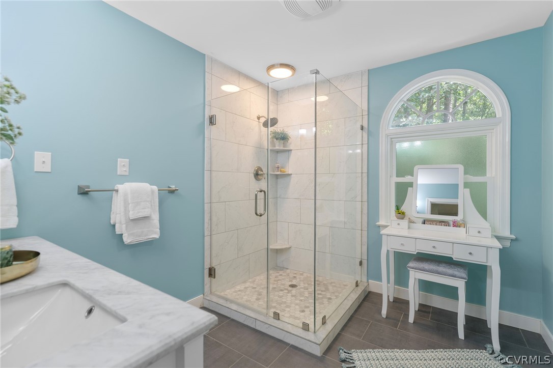 5423 Houndmaster Road Midlothian, VA 23112 - Photo 25 of 49 a bathroom with a shower a sink and a mirror