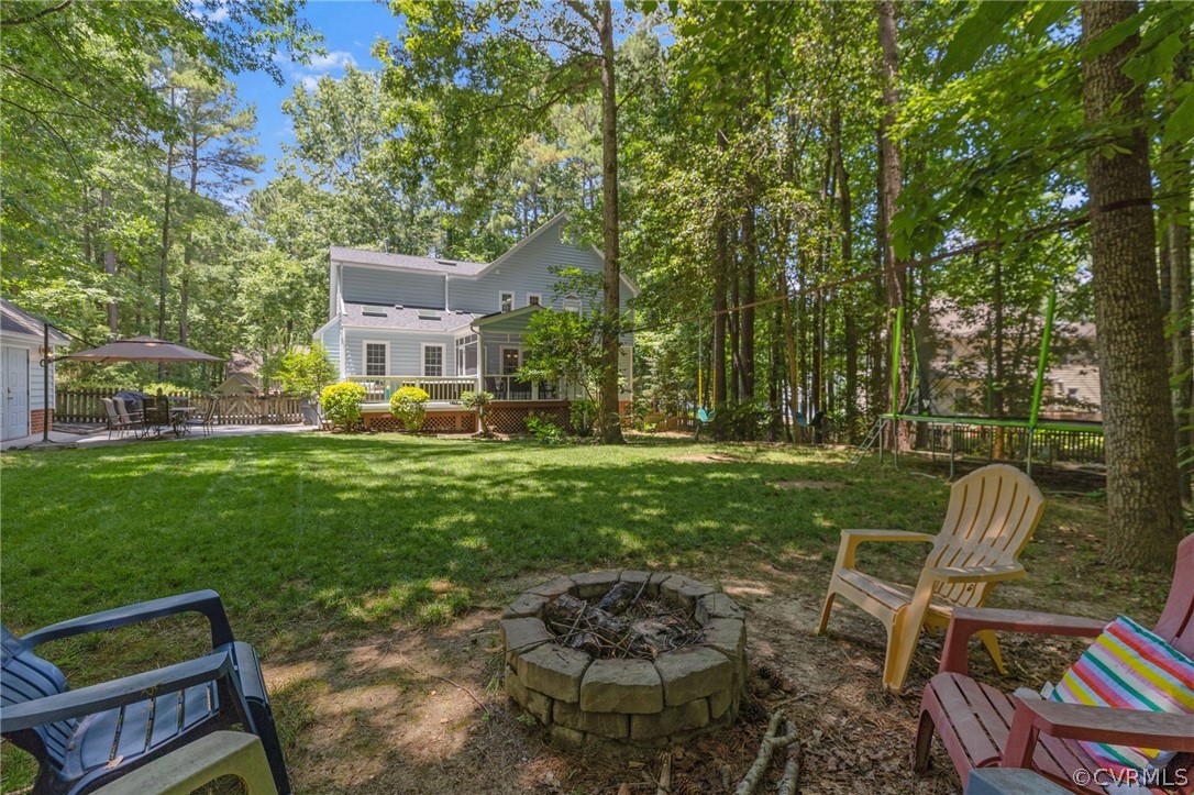 5423 Houndmaster Road Midlothian, VA 23112 - Photo 37 of 49 a view of a chair and table in the garden
