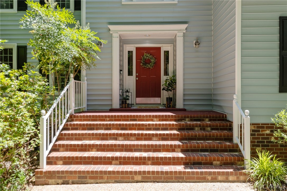 5423 Houndmaster Road Midlothian, VA 23112 - Photo 4 of 49 a front view of a house with a garden