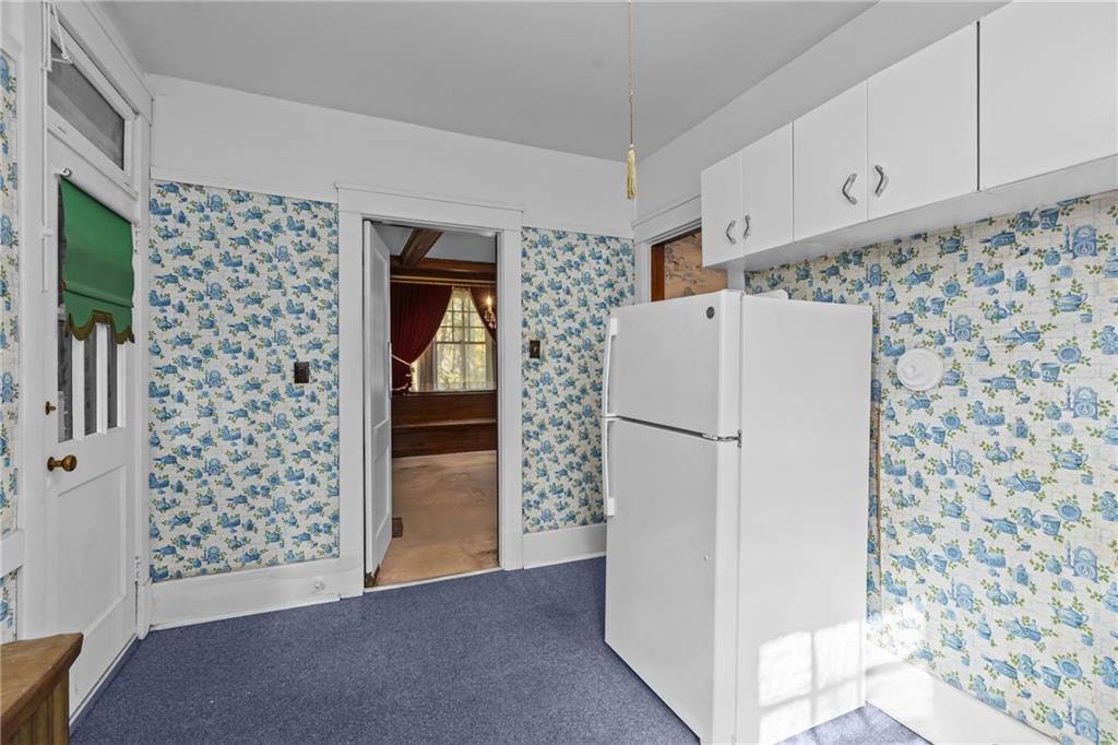 1050 Hiland Avenue Coraopolis, PA 15108 - Photo 16 of 33 a view of a kitchen with refrigerator and cabinet