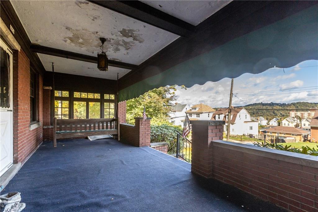 1050 Hiland Avenue Coraopolis, PA 15108 - Photo 2 of 33 a view of a porch with furniture and a gate