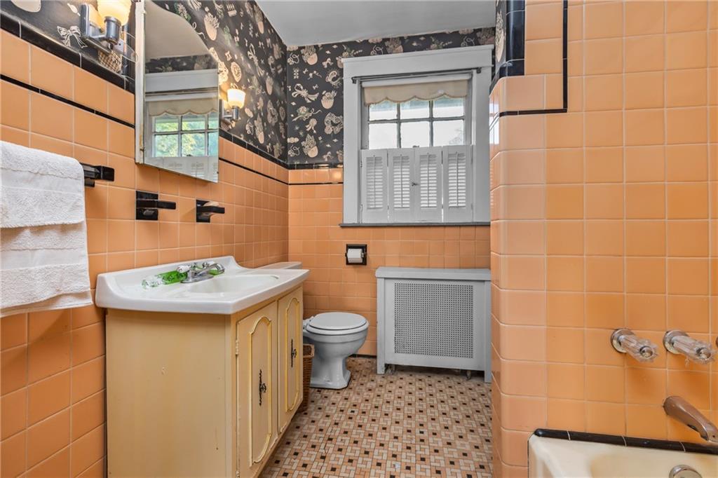 1050 Hiland Avenue Coraopolis, PA 15108 - Photo 27 of 33 a bathroom with a sink a toilet and shower