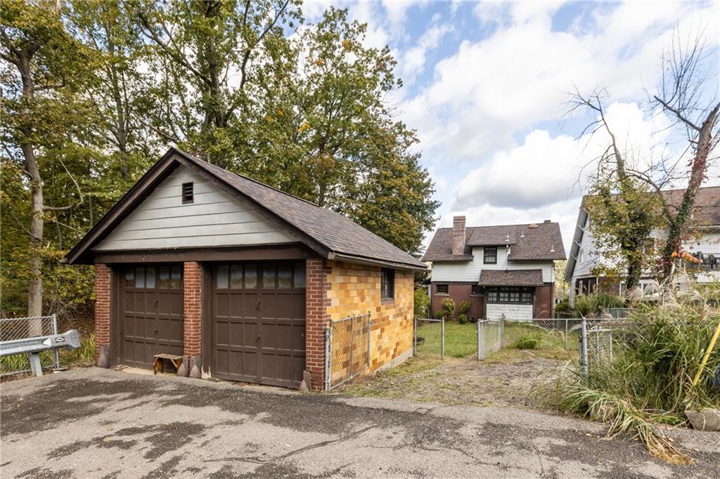 1050 Hiland Avenue Coraopolis, PA 15108 - Photo 29 of 33 a front view of a house with garden