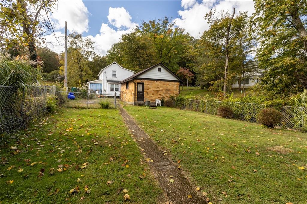 1050 Hiland Avenue Coraopolis, PA 15108 - Photo 31 of 33 a front view of a house with yard and green space