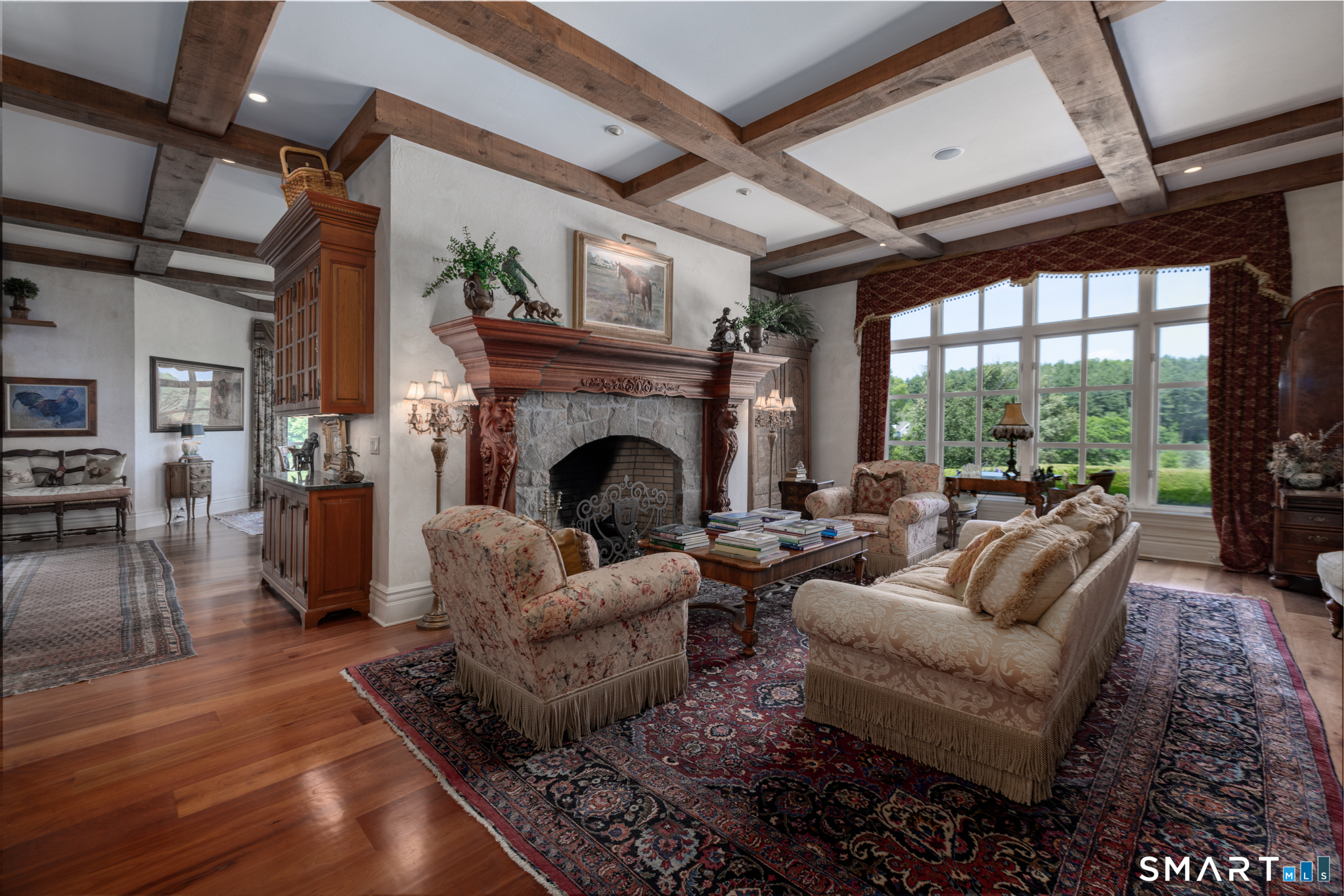 7 Equestrian Ridge Newtown, CT 06470 - Photo 11 of 40 a living room with furniture large window and a fireplace