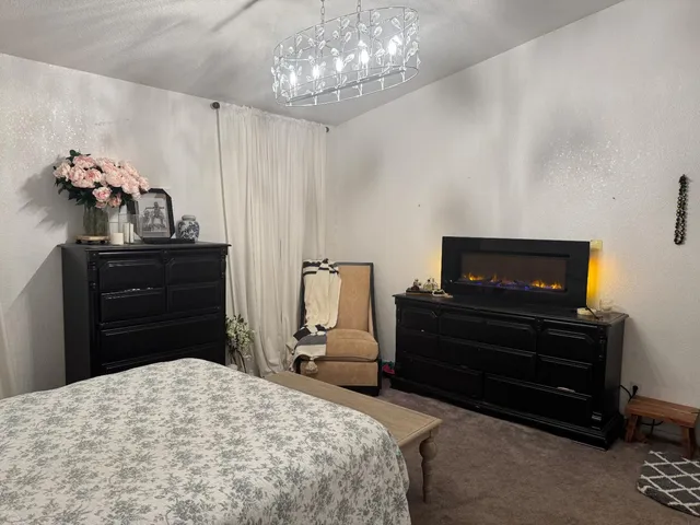 a bedroom with a bed and dresser