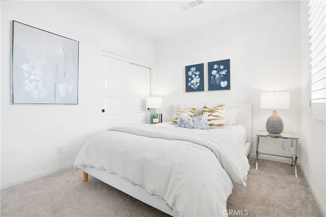 a front view of a house with yard and trees