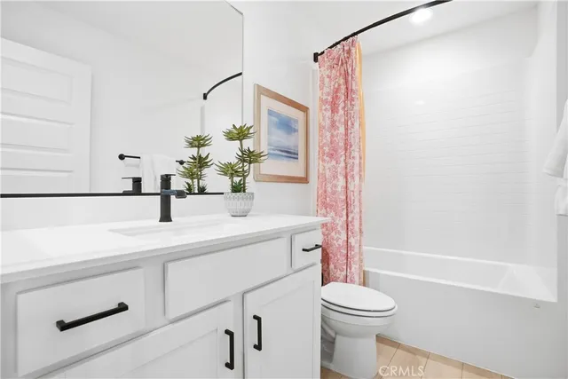 an aerial view of residential houses with outdoor space and river