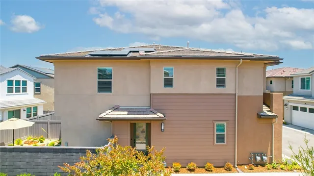 a view of multiple houses with outdoor space swimming pool