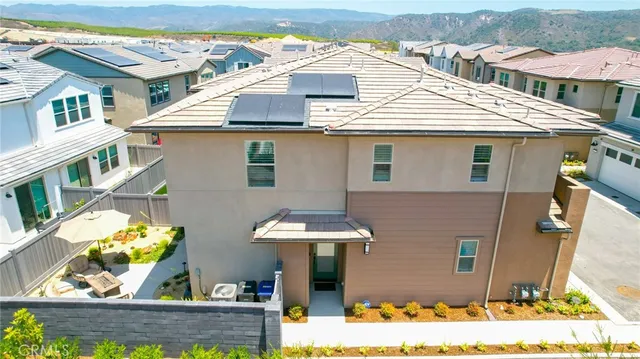 a view of a swimming pool and lounge chairs