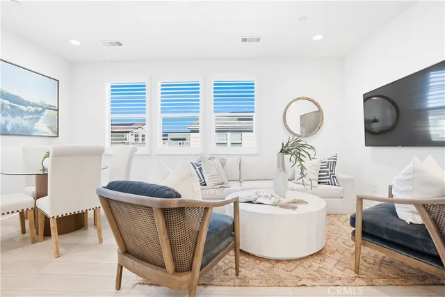 a bedroom with a bed and a chair