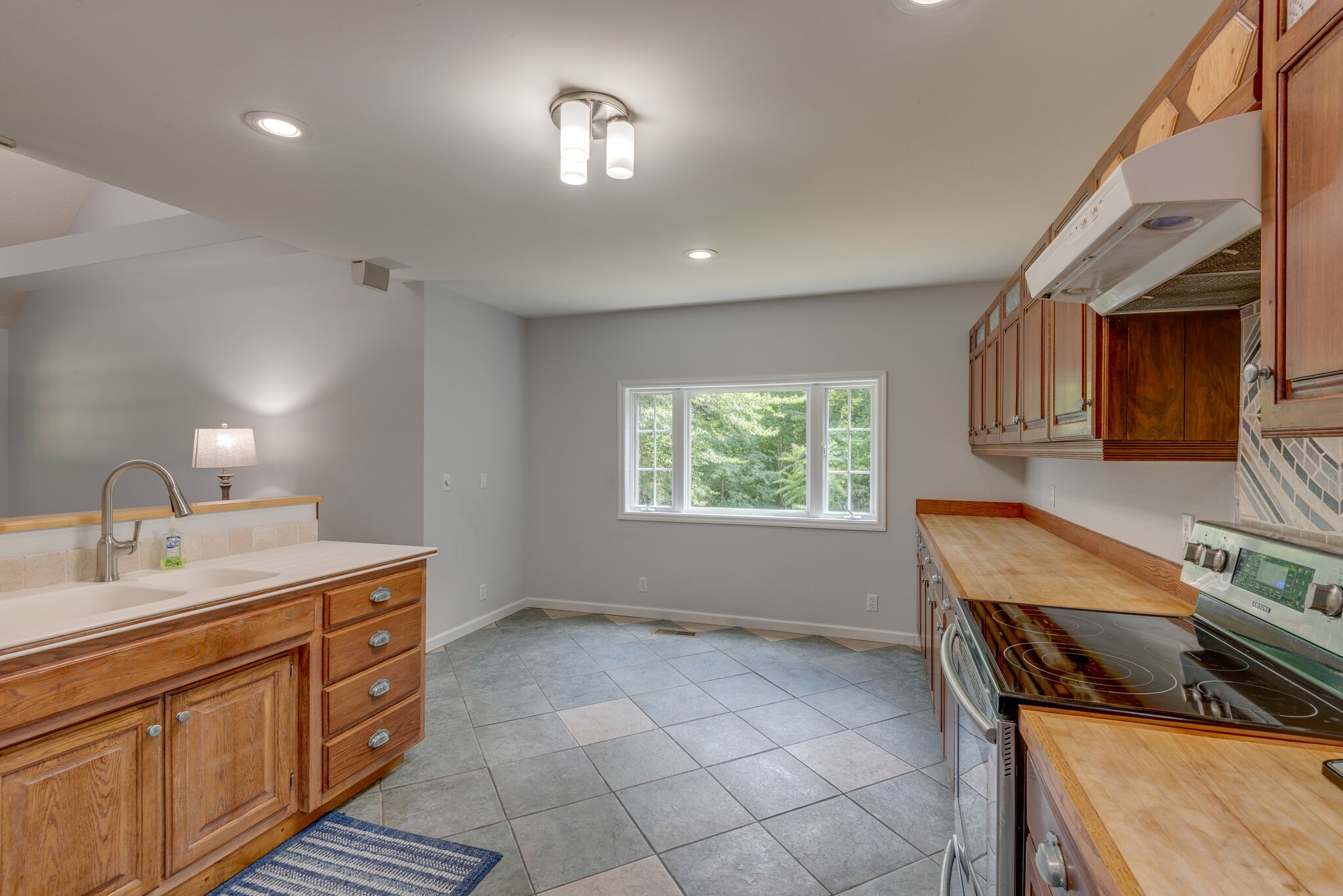 1803 East Piney Road Dickson, TN 37055 - Photo 14 of 46 a kitchen that has a sink and a stove