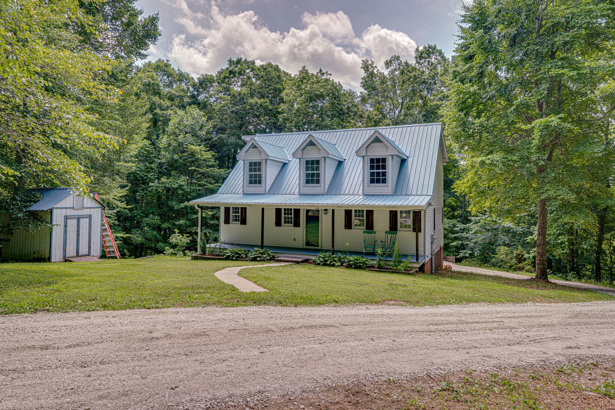 1803 East Piney Road Dickson, TN 37055 - Photo 5 of 46 a view of a house with a big yard and large trees