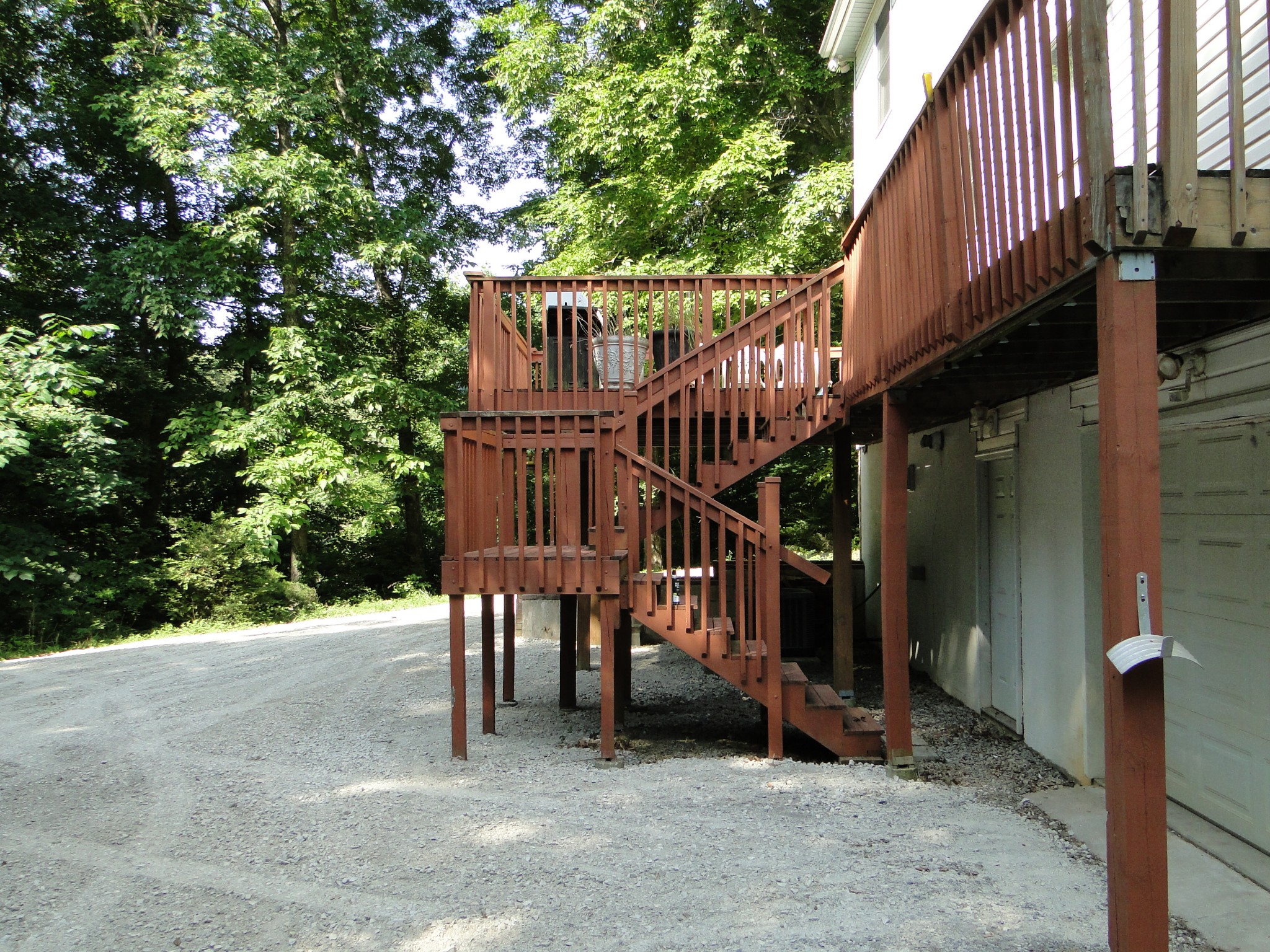 1803 East Piney Road Dickson, TN 37055 - Photo 41 of 46 a view of wooden house with a deck and a yard