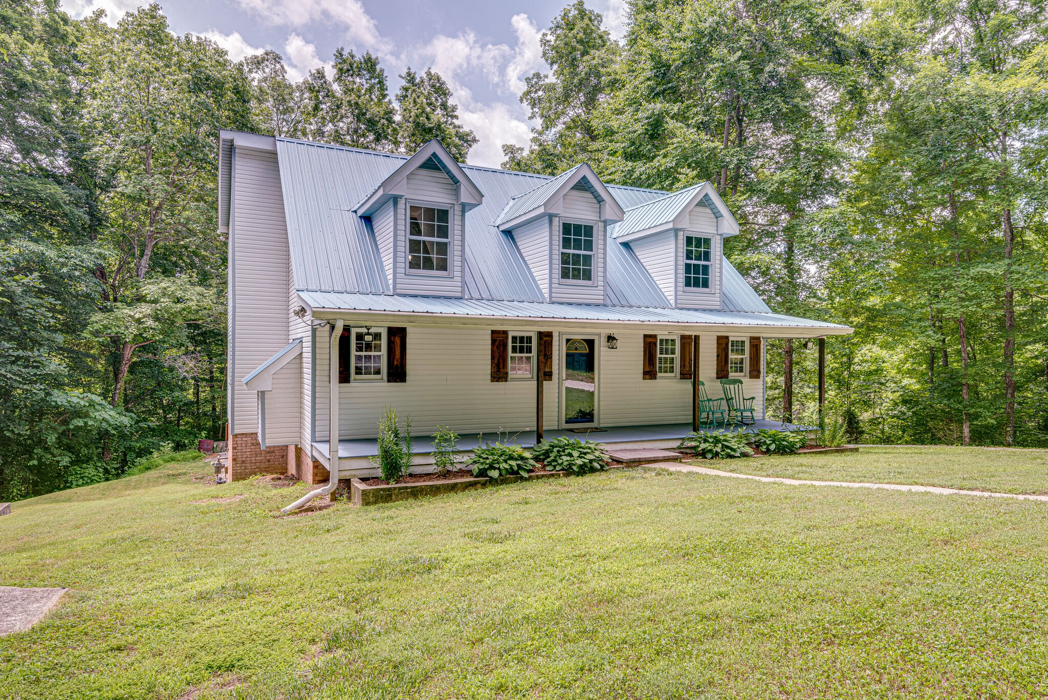 1803 East Piney Road Dickson, TN 37055 - Photo 6 of 46 a front view of a house with a yard