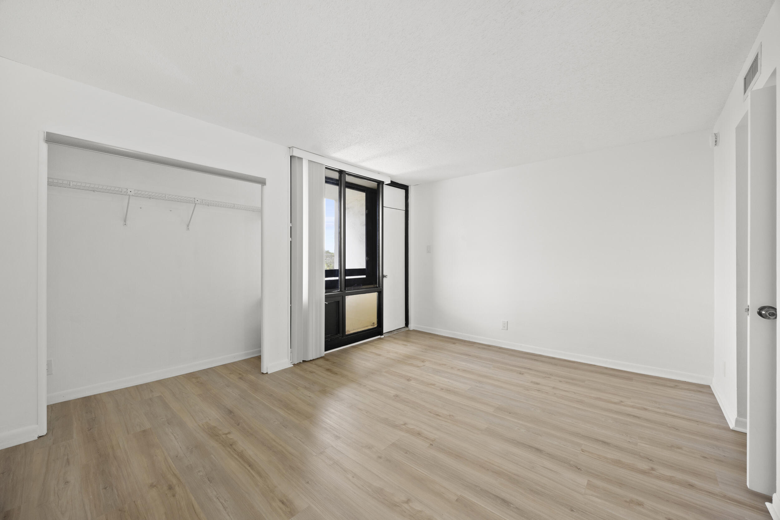 1401 South Federal Highway, Unit 220 Boca Raton, FL 33432 - Photo 20 of 27 a view of an empty room with wooden floor