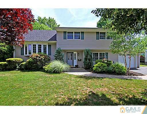8 June Way Middlesex, NJ 08846 - Photo 1 of 25 a view of a house with a garden and plants
