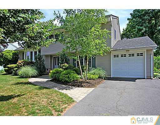 8 June Way Middlesex, NJ 08846 - Photo 2 of 25 a front view of a house with a yard