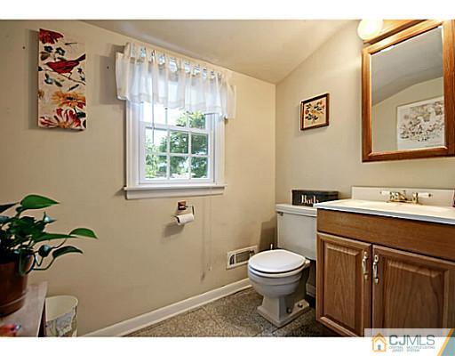 8 June Way Middlesex, NJ 08846 - Photo 13 of 25 a bathroom with a toilet a sink and a window
