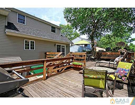 8 June Way Middlesex, NJ 08846 - Photo 20 of 25 a view of a backyard with chairs and a patio