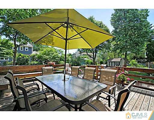 8 June Way Middlesex, NJ 08846 - Photo 21 of 25 a view of table and chairs under an umbrella