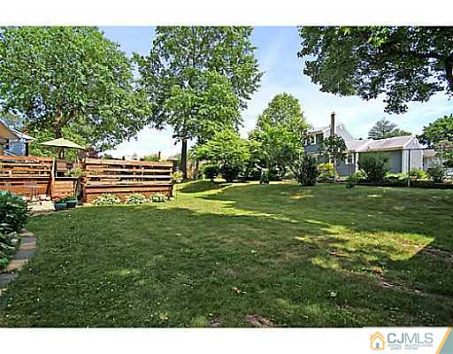 8 June Way Middlesex, NJ 08846 - Photo 23 of 25 a backyard of a house with lots of green space
