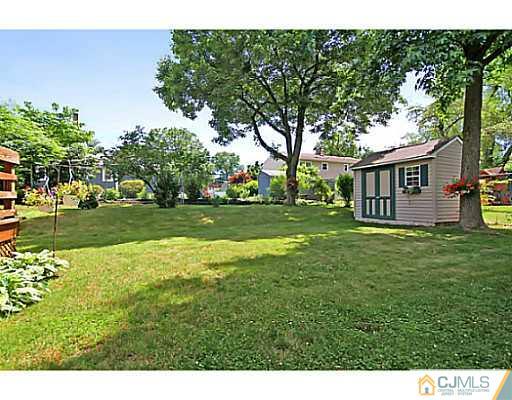 8 June Way Middlesex, NJ 08846 - Photo 25 of 25 a view of a house with a big yard