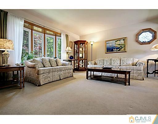 8 June Way Middlesex, NJ 08846 - Photo 5 of 25 a living room with furniture and a large window