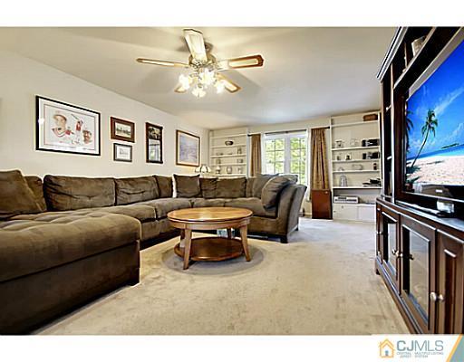 8 June Way Middlesex, NJ 08846 - Photo 6 of 25 a living room with furniture and a flat screen tv